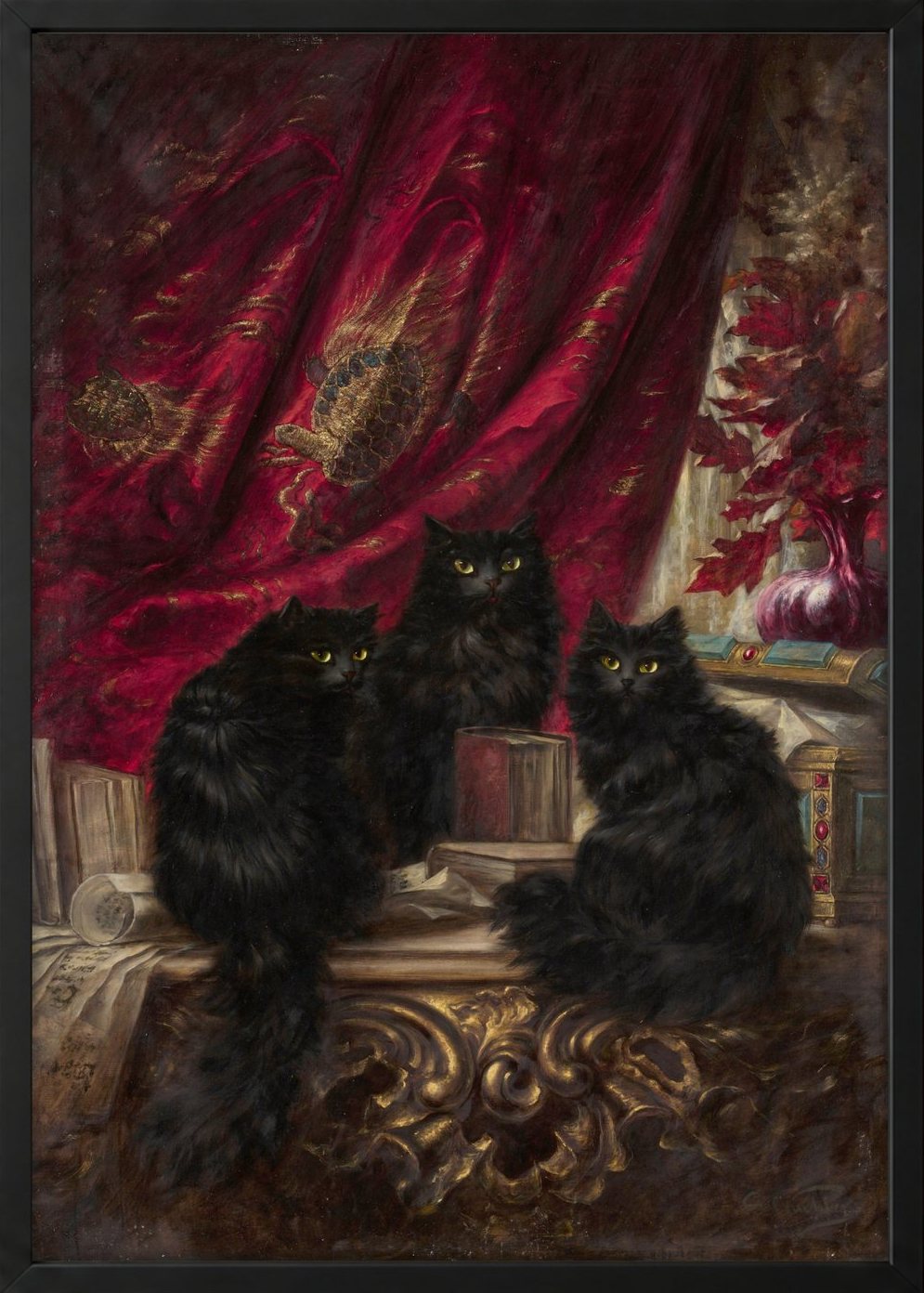 Three Black Cats by Carl Kahler as a framed print in a black frame. Three long-haired black cats with yellow eyes sit on a gilded table before a crimson velvet curtain.